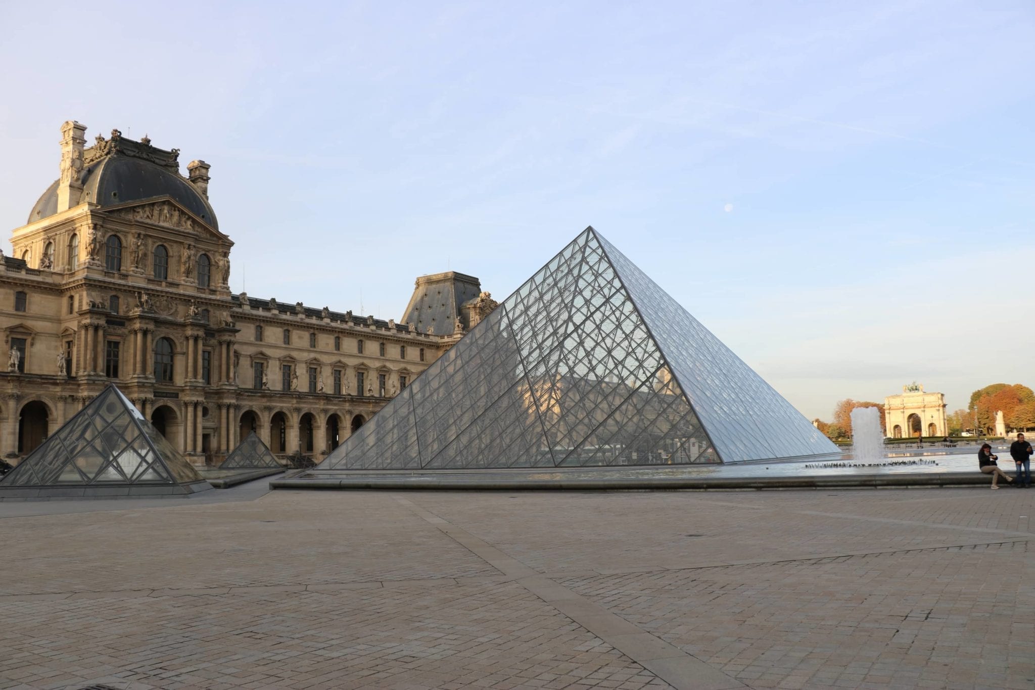 A large glass pyramid at the Louvre
