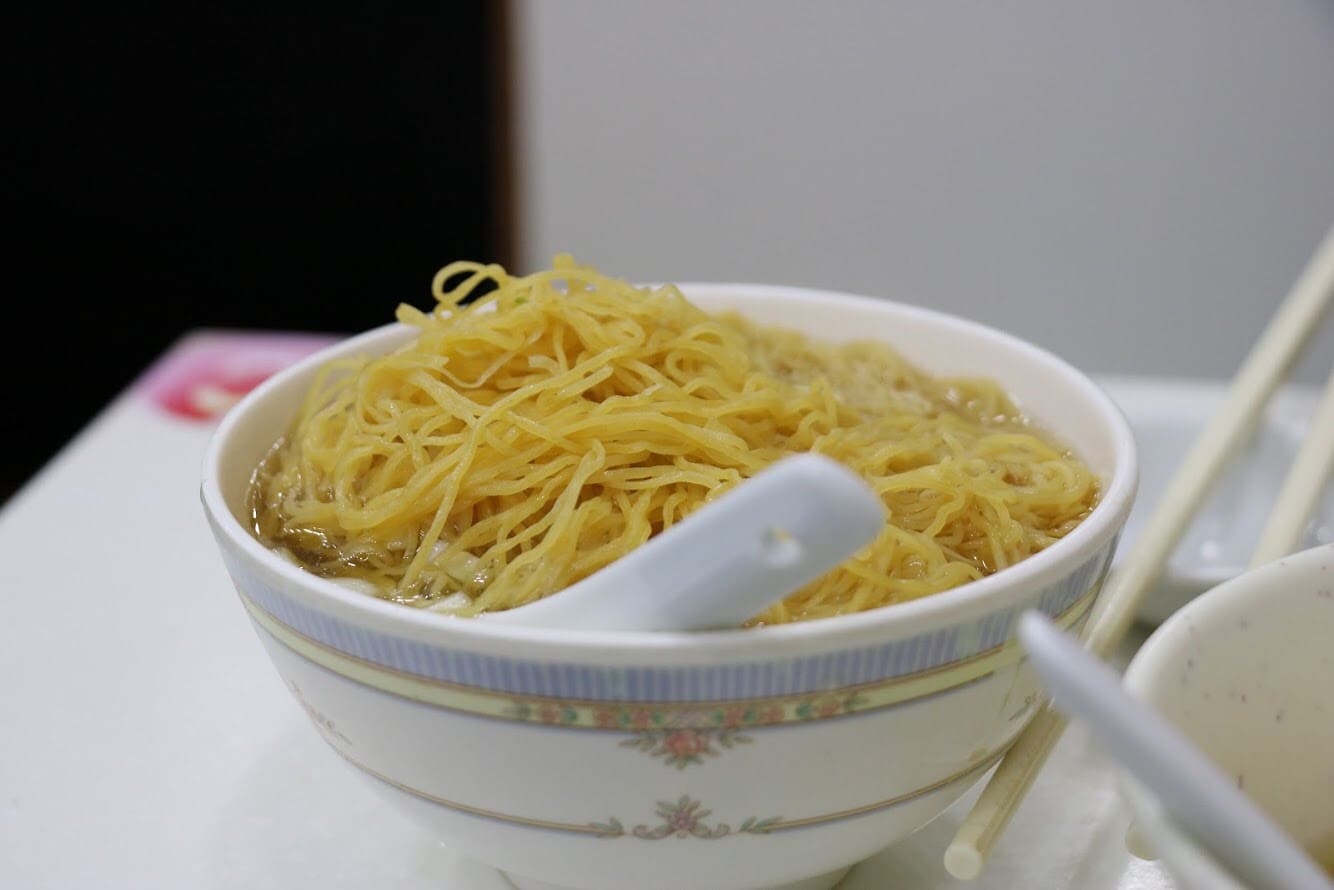 A bowl of yellow egg-noodles