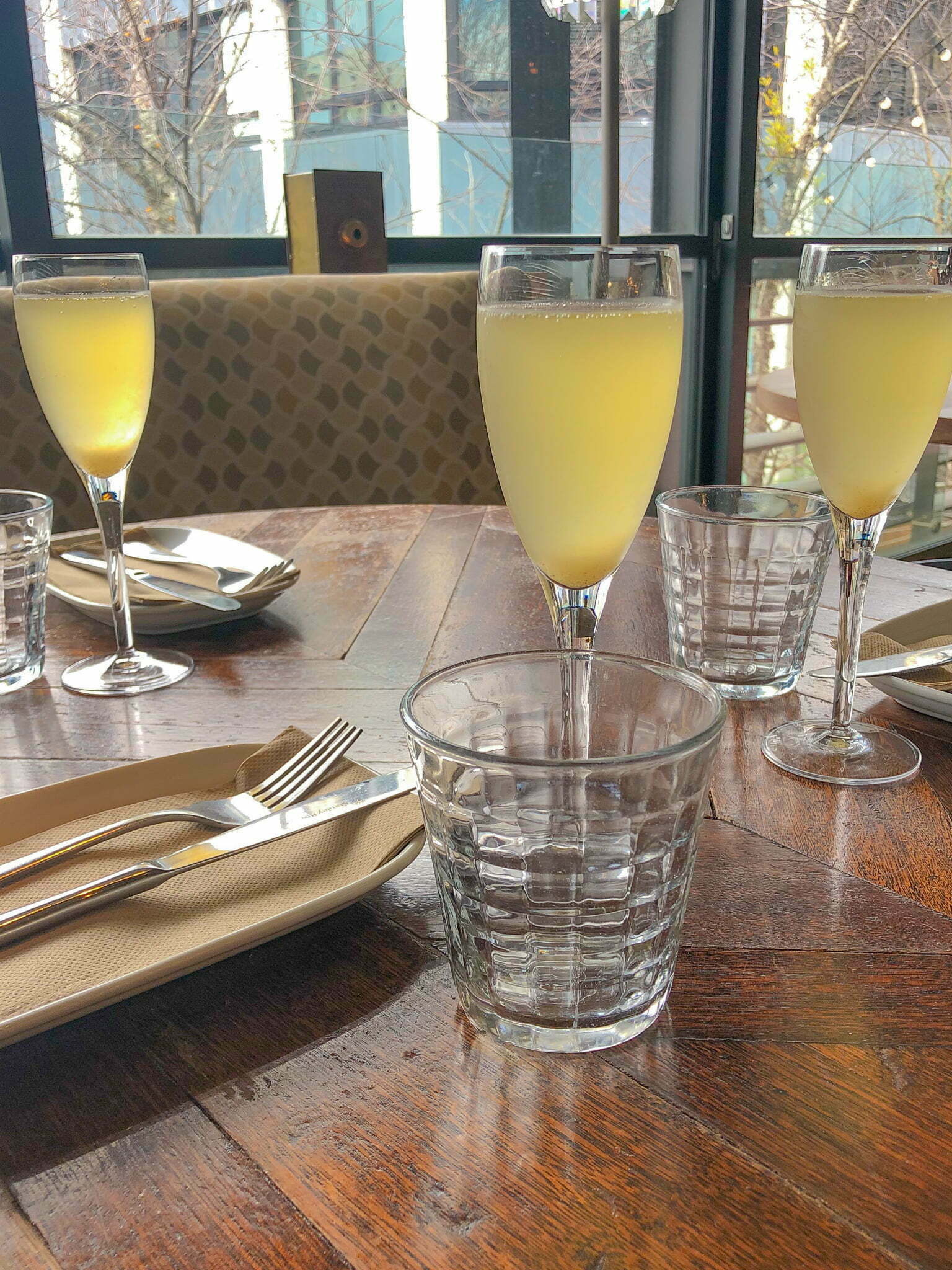 Three champagne glasses on a table