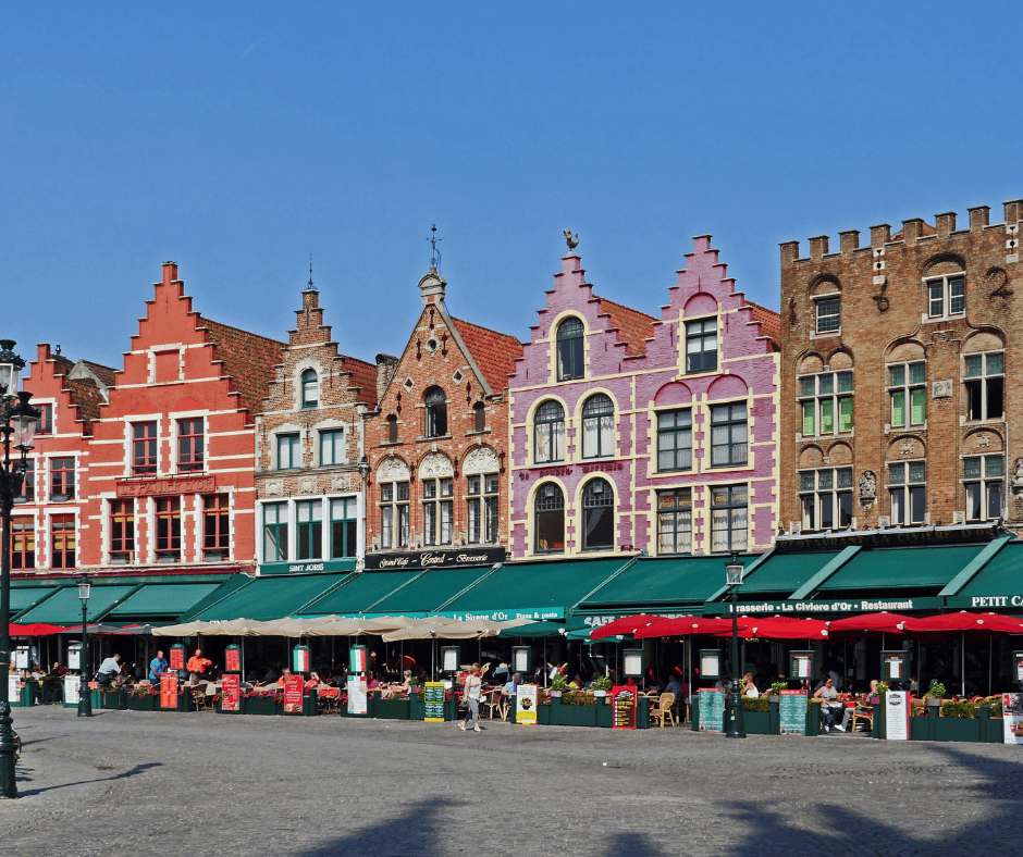 Coloured houses in the background with market stalls in the foreground