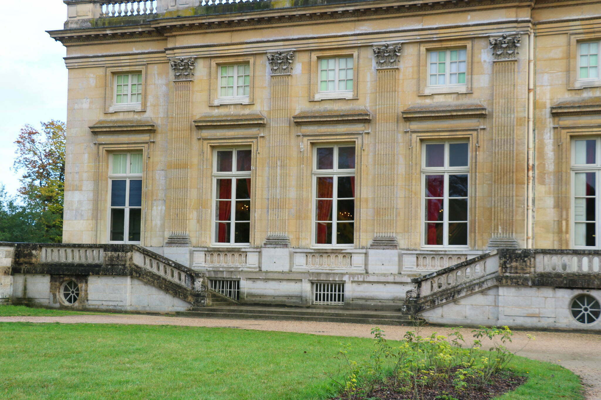 The exterior of the Petit Trianon with the gardens in the foreground